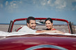 Photo: man and beautiful woman hugging in cabriolet car man and beautiful woman hugging in cabriolet car