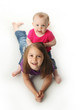 Big sister and baby sister playing