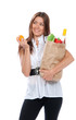 Happy young woman holding a shopping bag full of groceries,