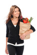 woman hold shopping paper bag full of vegetarian groceries