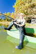 fishing woman sitting on boat