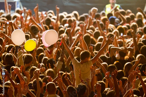 Photo: yellow lighted arded crowd yellow lighted arded crowd