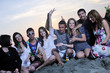 Group of young people enjoy summer party at the beach Group of young people enjoy summer party at the beach