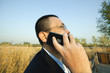 side view of an asian businessman talking on cellphone