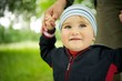 Smiling baby standing outdoors