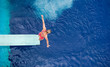 Photo: preparing to dive into a swimming pool preparing to dive into a swimming pool