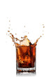 splash of cola in glass isolated on white