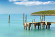 Photo en ligne au meilleur prix Mooring posts and pontoon leading in turquoise blue sea