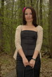 Female in the forest holding a bag