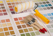 Foto: Brushes and a paint roller on color palette Brushes and a paint roller on color palette