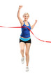 Female runner running towards a finish line