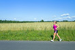 Running woman on summer country road Running woman on summer country road