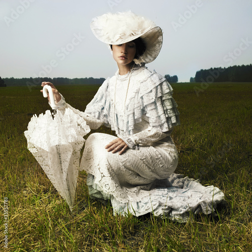 Photo: Woman in vintage dress Woman in vintage dress