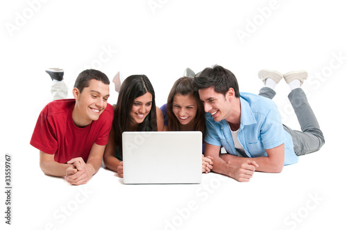 Photo: Friends having fun at laptop Friends having fun at laptop