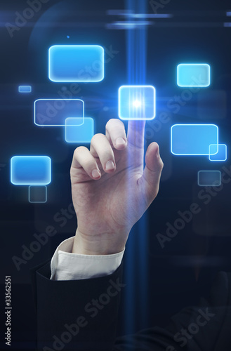 Photo: hand pushing a button on a touch screen interface hand pushing a button on a touch screen interface