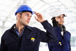 Two engineers working in a construction site