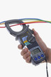 men hold an ampmeter