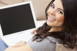 Happy Hispanic Woman Using Laptop Computer