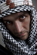 Serious middle eastern man looking to you