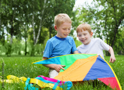 Photo: Portrait of happy boys in the summer outdoors Portrait of happy boys in the summer outdoors