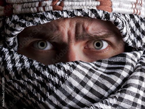 Photo: Scared middle eastern man looking to you Scared middle eastern man looking to you