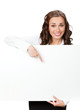 Smiling businesswoman showing blank signboard, isolated