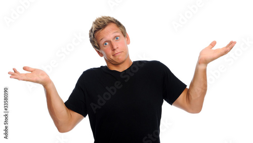 Photo: Man shrugs shoulders Man shrugs shoulders