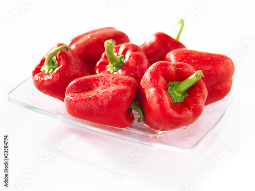 Photo: Red sweet pepper on a glass plate Red sweet pepper on a glass plate
