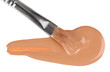 Beige liquid foundation makeup stroke with brush, isolated on wh