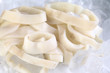 Cut raw calamari rings on ice Cut raw calamari rings on ice