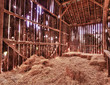 Interior of old barn with straw bales