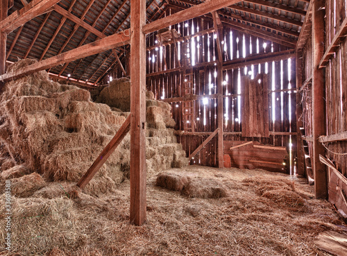 Photo: Interior of old barn with straw bales Interior of old barn with straw bales