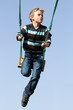 Happy child on a swing