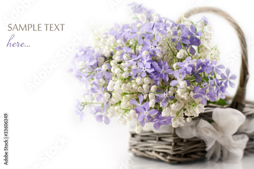 Photo: Spring flowers in basket Spring flowers in basket