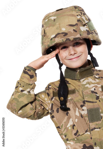 Photo: Saluting soldier. Young boy Saluting soldier. Young boy