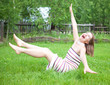 Young women falling on grass Young women falling on grass