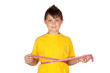 Funny child with yellow t-shirt with a tape measure