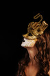 sexy woman in golden party mask