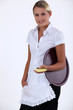 Young waitress with order pad and tray