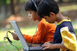 Boy and girl using Computer and gadget