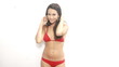 Beautiful woman in red swimsuit dancing