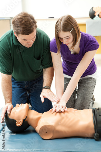 Photo: Teen Girl Practices CPR Teen Girl Practices CPR