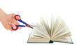 Hand with scissors cutting book