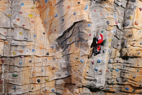 Photo: Santa Claus on rock wall Santa Claus on rock wall