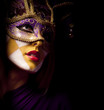 portrait of sexy woman in violet party mask
