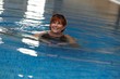 Happy mature woman in swimming pool