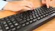 Businesswoman typing on a keyboard