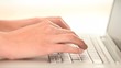 Hands typing on a keyboard