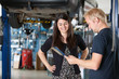 Happy Female Customer at Mechanic