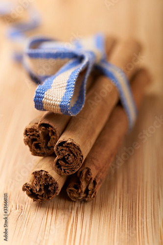 Photo: cinnamon sticks on a wood table cinnamon sticks on a wood table
